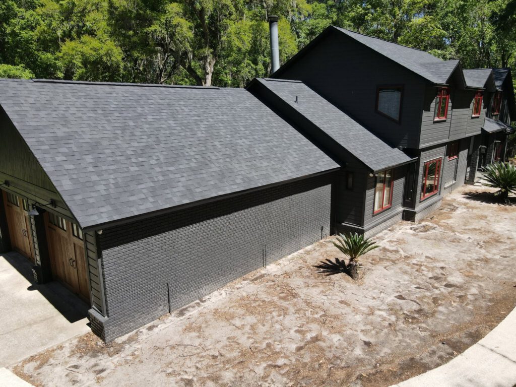 A modern home with a finished dark roof and clean trim lines