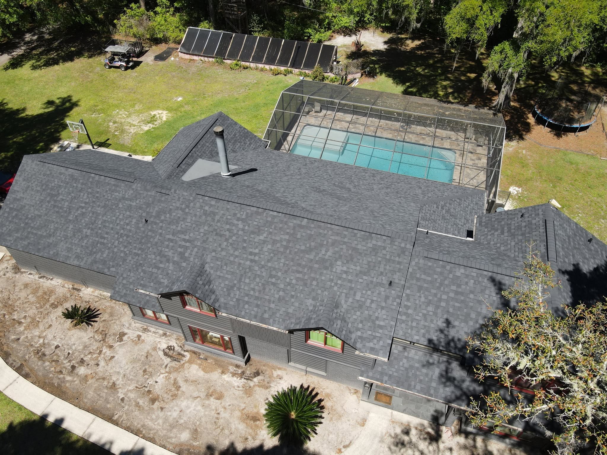 A Gainesville roof mid tear-off with the crew working