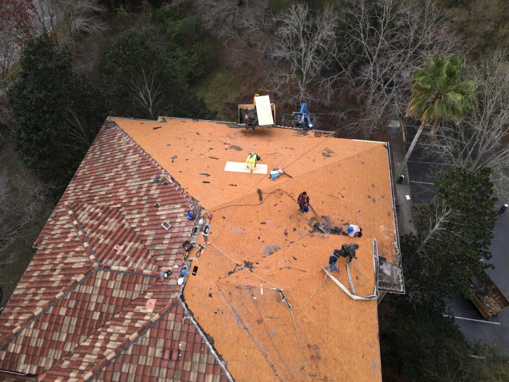 A storm-damaged roof stripped and dried in by Retex Roofing