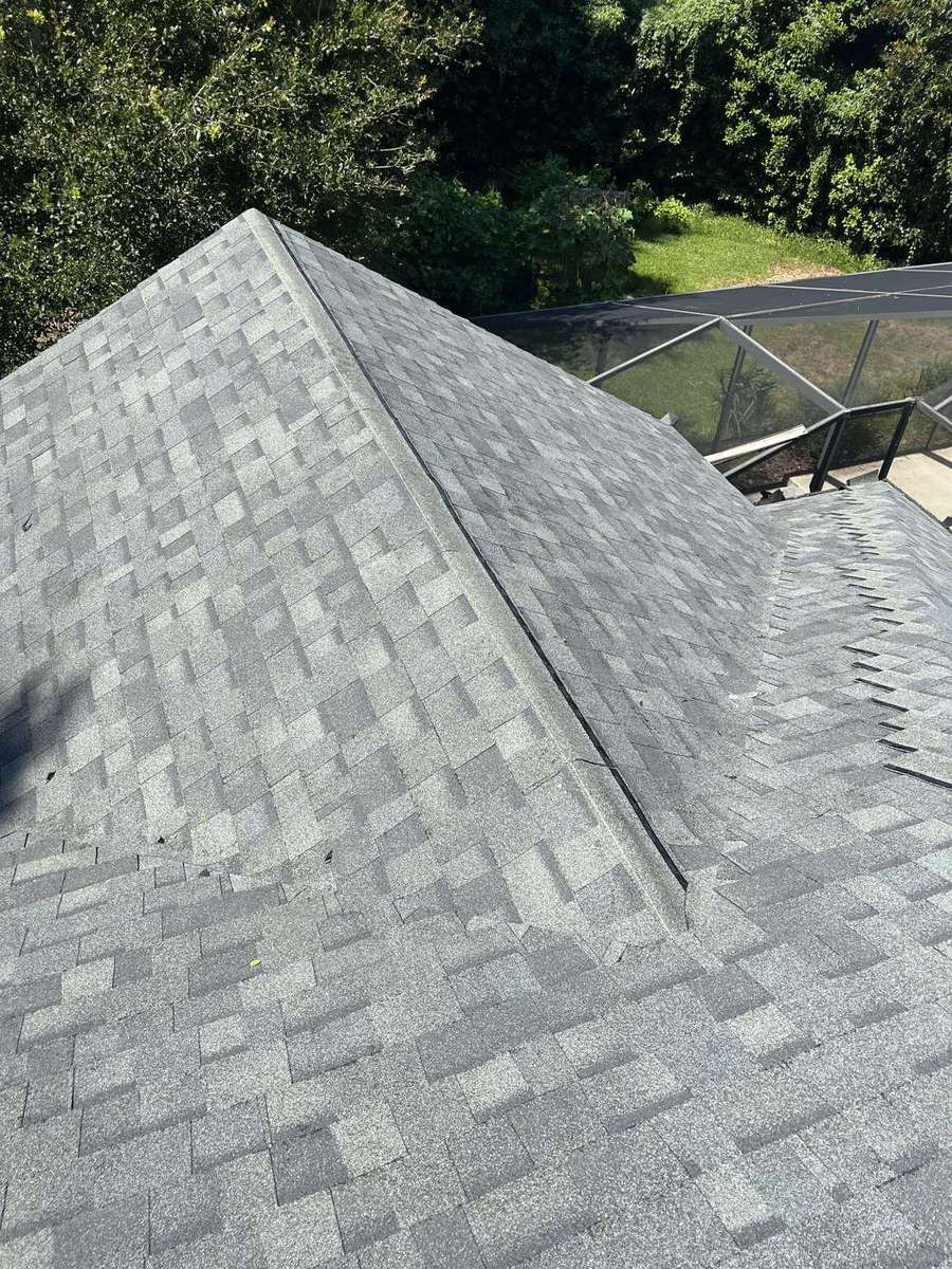 Hip and ridge cap shingles on an architectural shingle roof